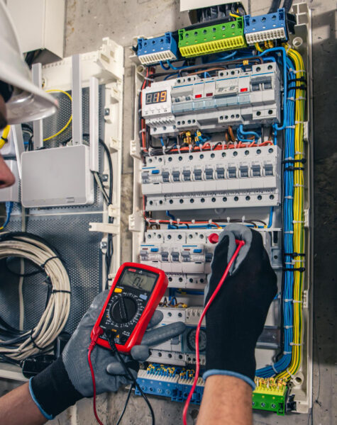 man-electrical-technician-working-switchboard-with-fuses